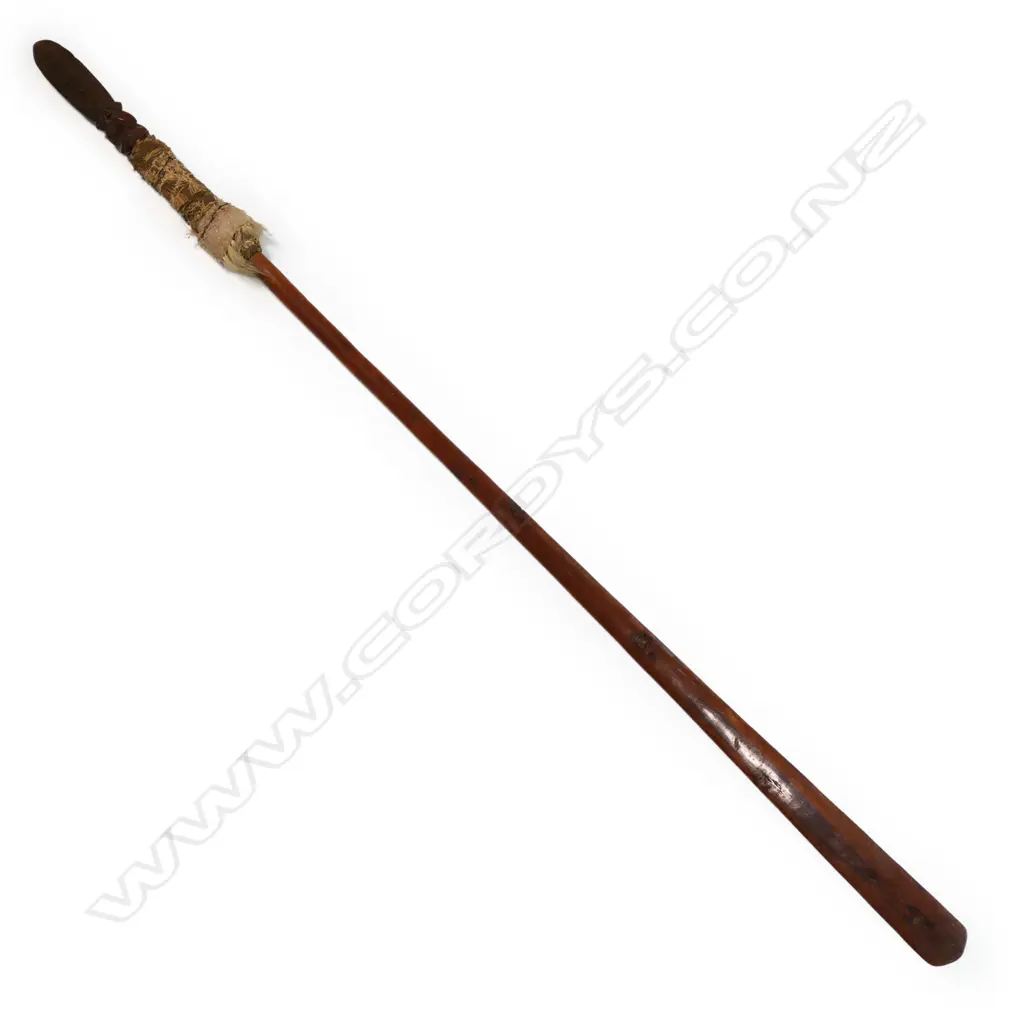 A 19thC or earlier Māori carved wooden taiaha with feather and dog hair wrap, Image 1++
